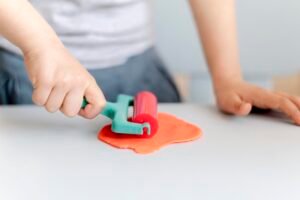 close-up-boy-playing-with-plasticine