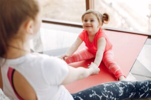 Mother and daughter training in a gym